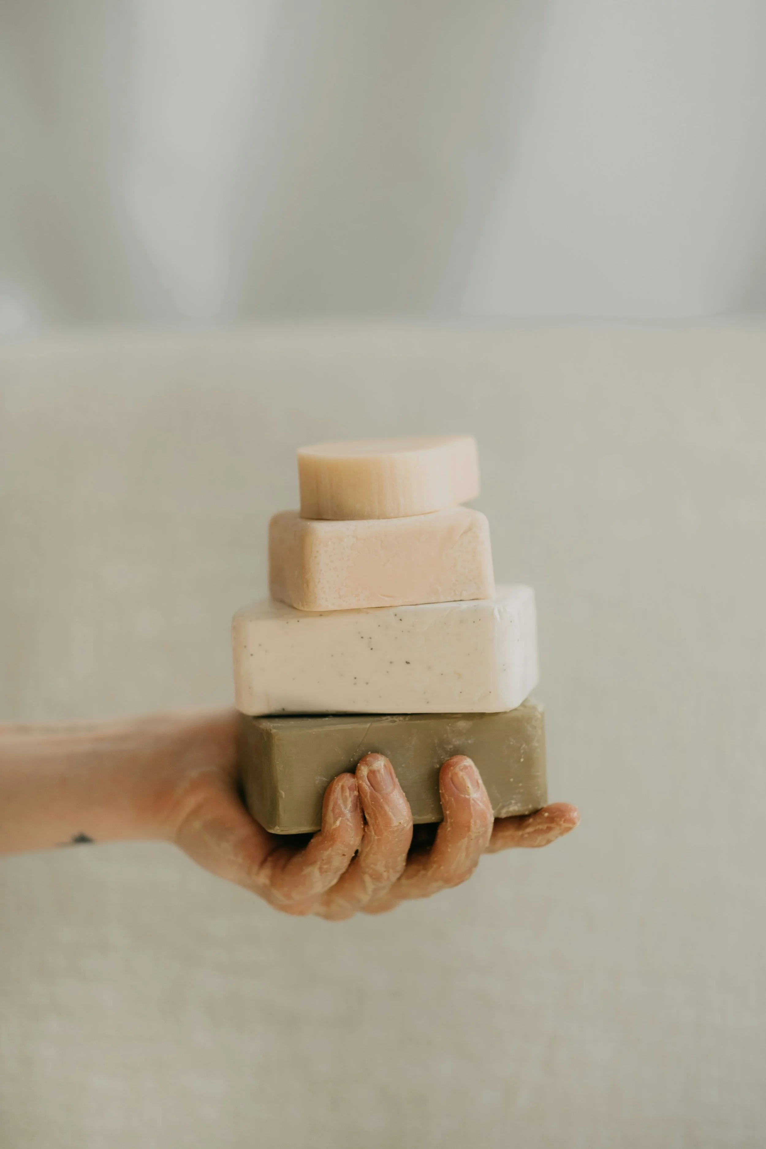 Hand Holding Soap Bars | Personal Care Products in Plastic can also effect your body and hormones!