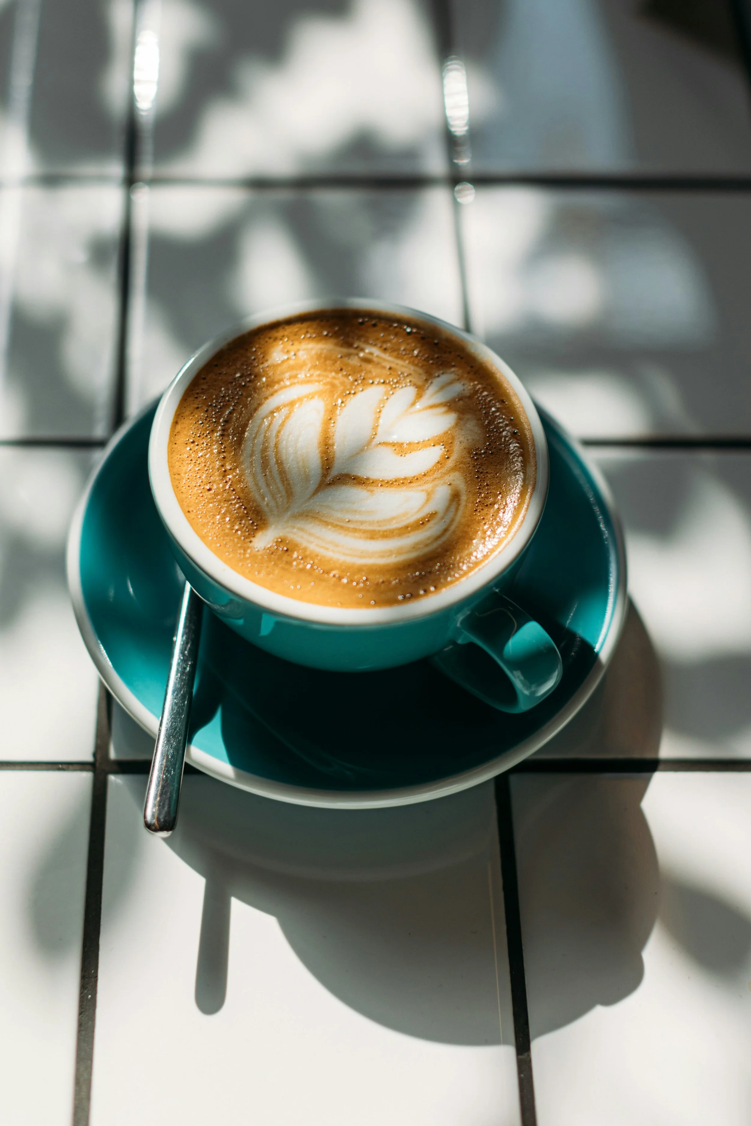 Coffee Latte in Mug on Counter | If you order hot coffee at a coffee shop - bring your own mug to help reduce exposure to microplastics