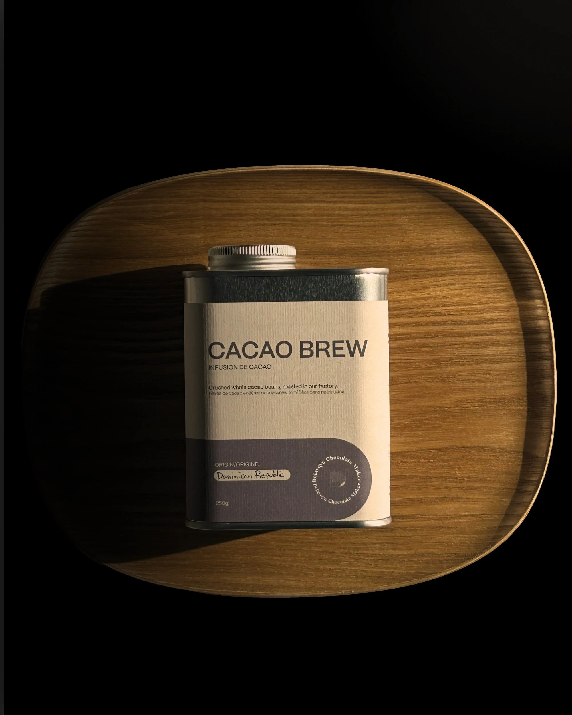 Cacao Brew tin on a wooden tray