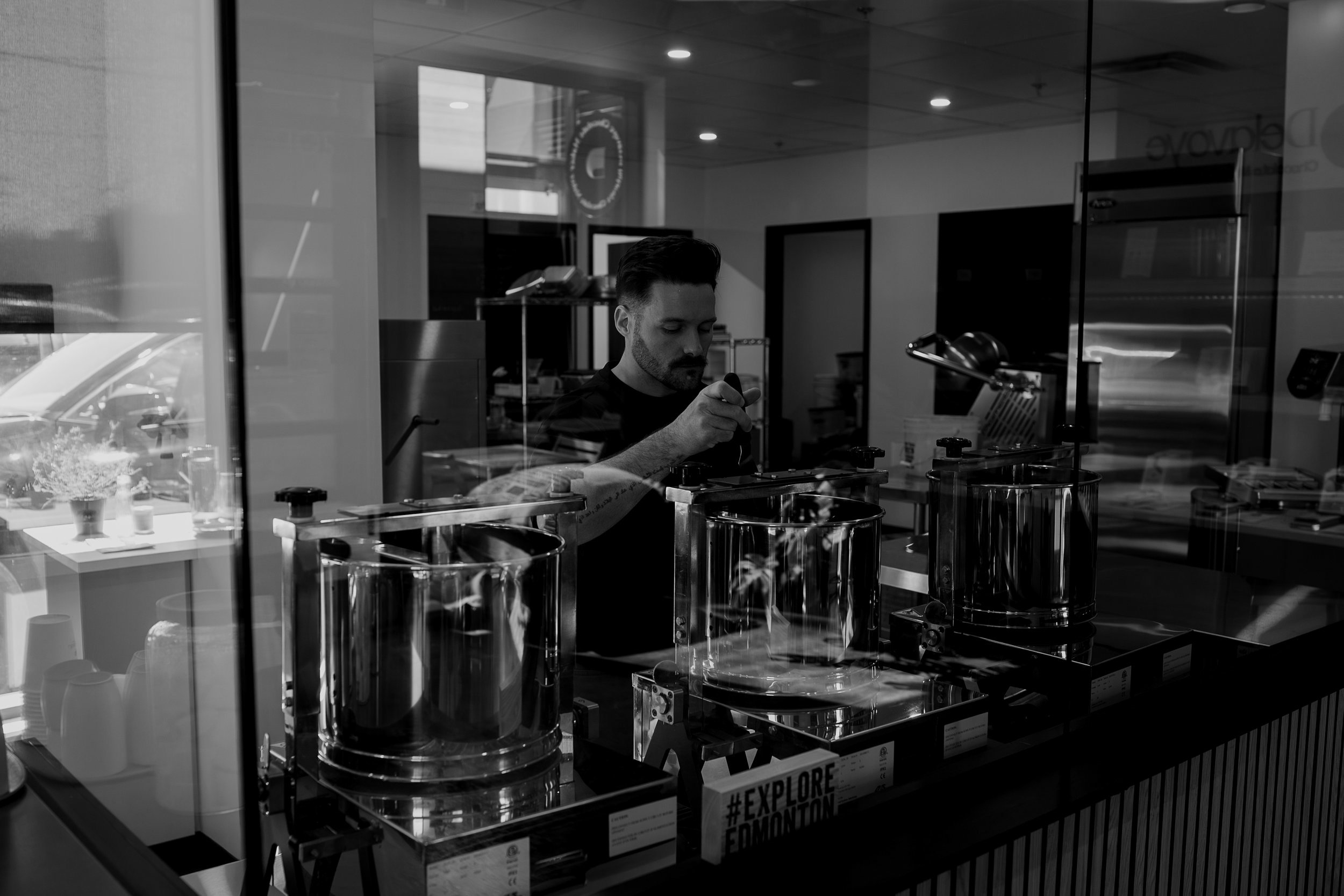 Founder and Chocolate Maker, Antoine Lavoie, performing quality control over a stone melanger.