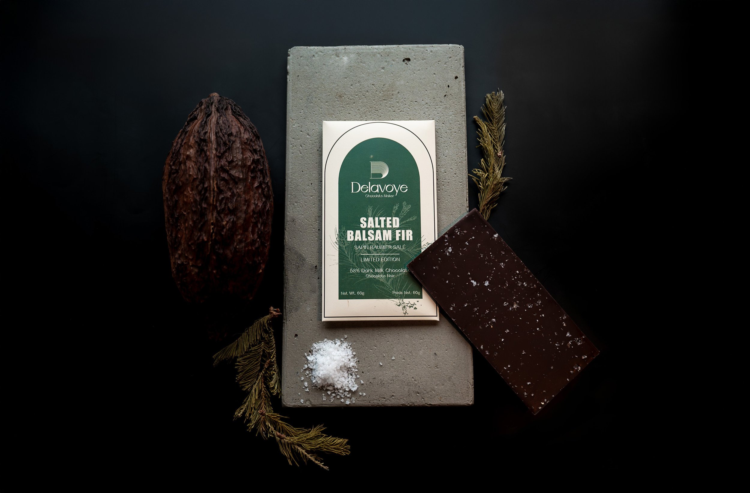 A holiday limited edition 58% Dark Milk Salted Balsam Fir chocolate bar from Delavoye Chocolate Maker