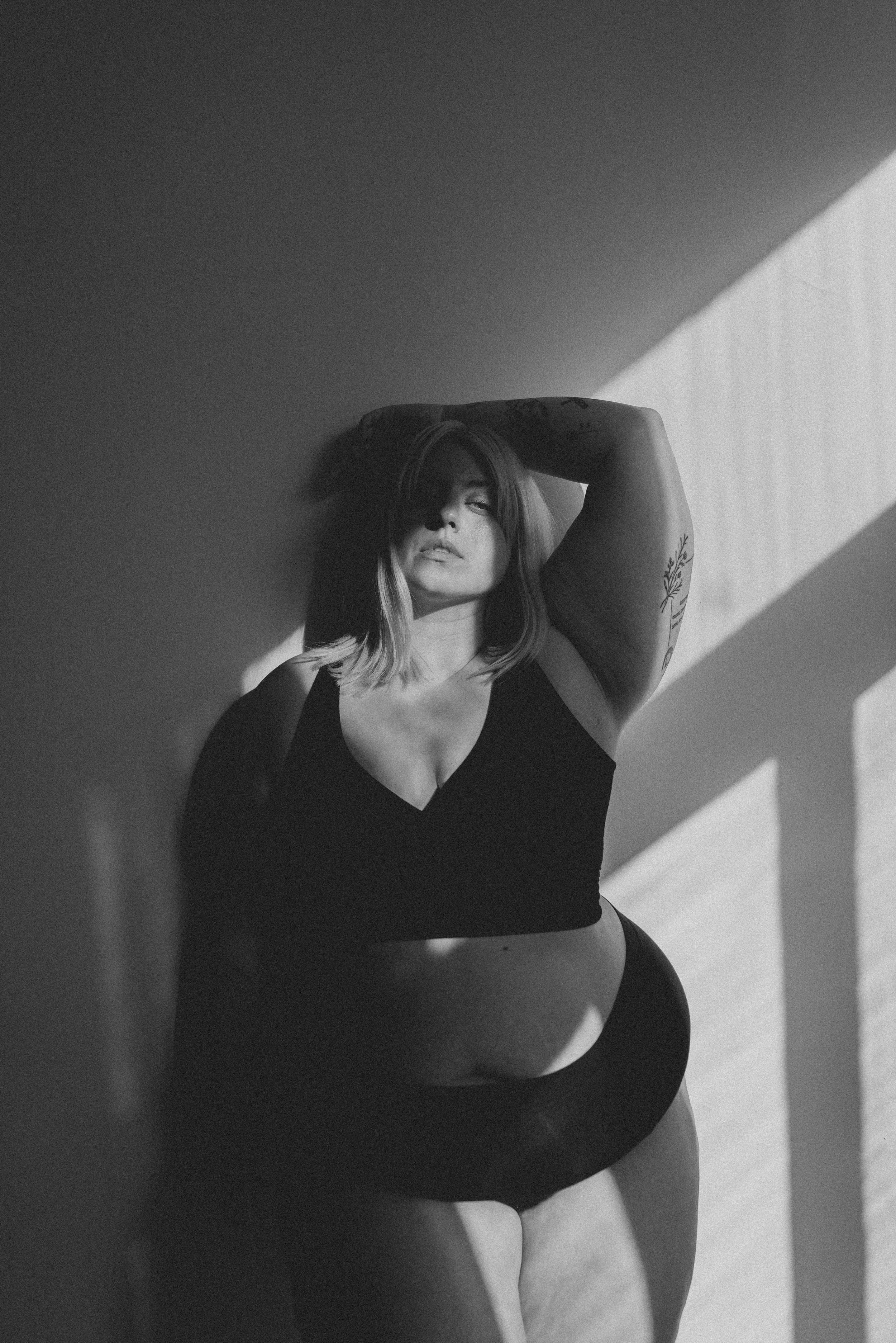 Natural light portrait of plus sized woman in Vancouver, BC studio