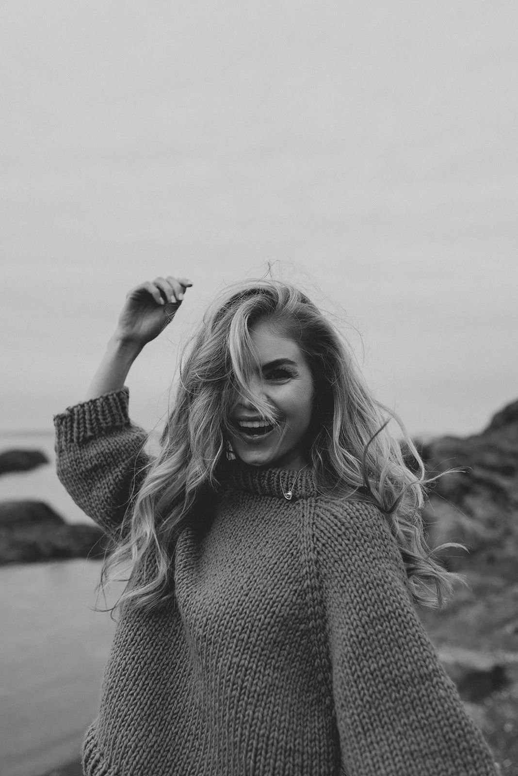 Black and white portrait of a beautiful woman by the ocean in Victoria, BC