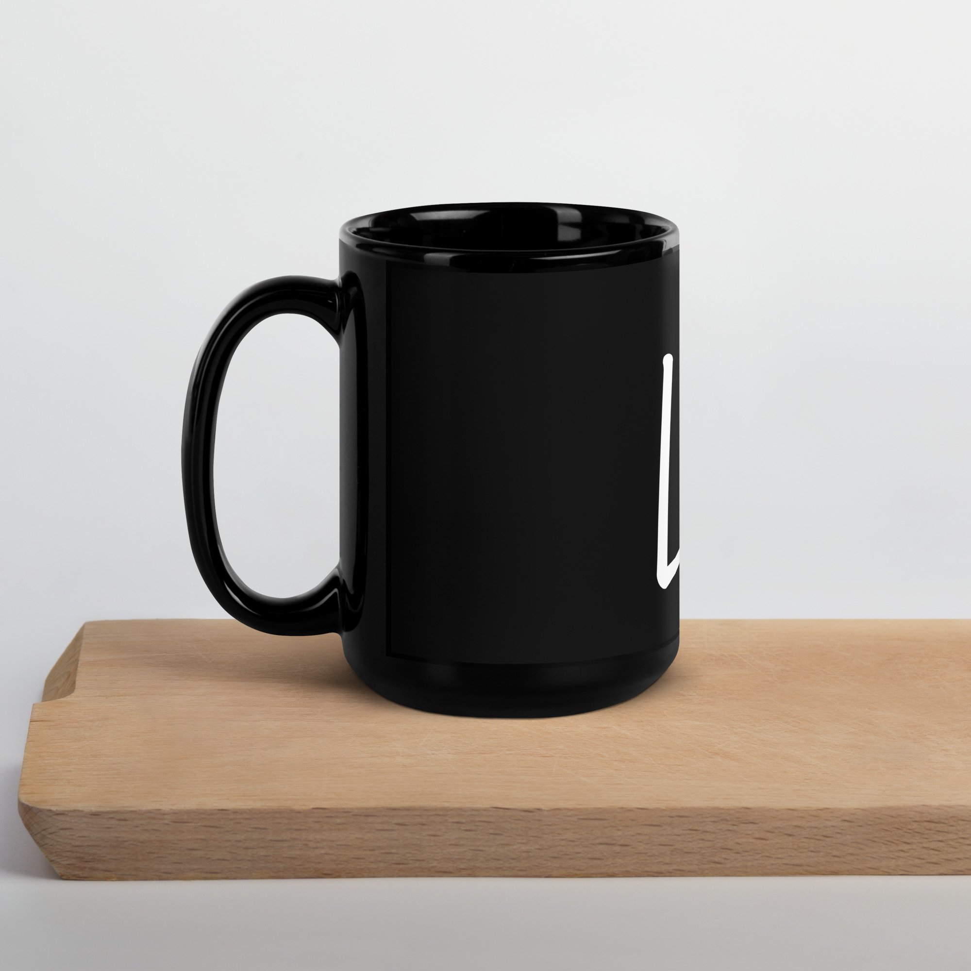 black-glossy-mug-black-15oz-handle-on-left-63e7a959bffce.jpg