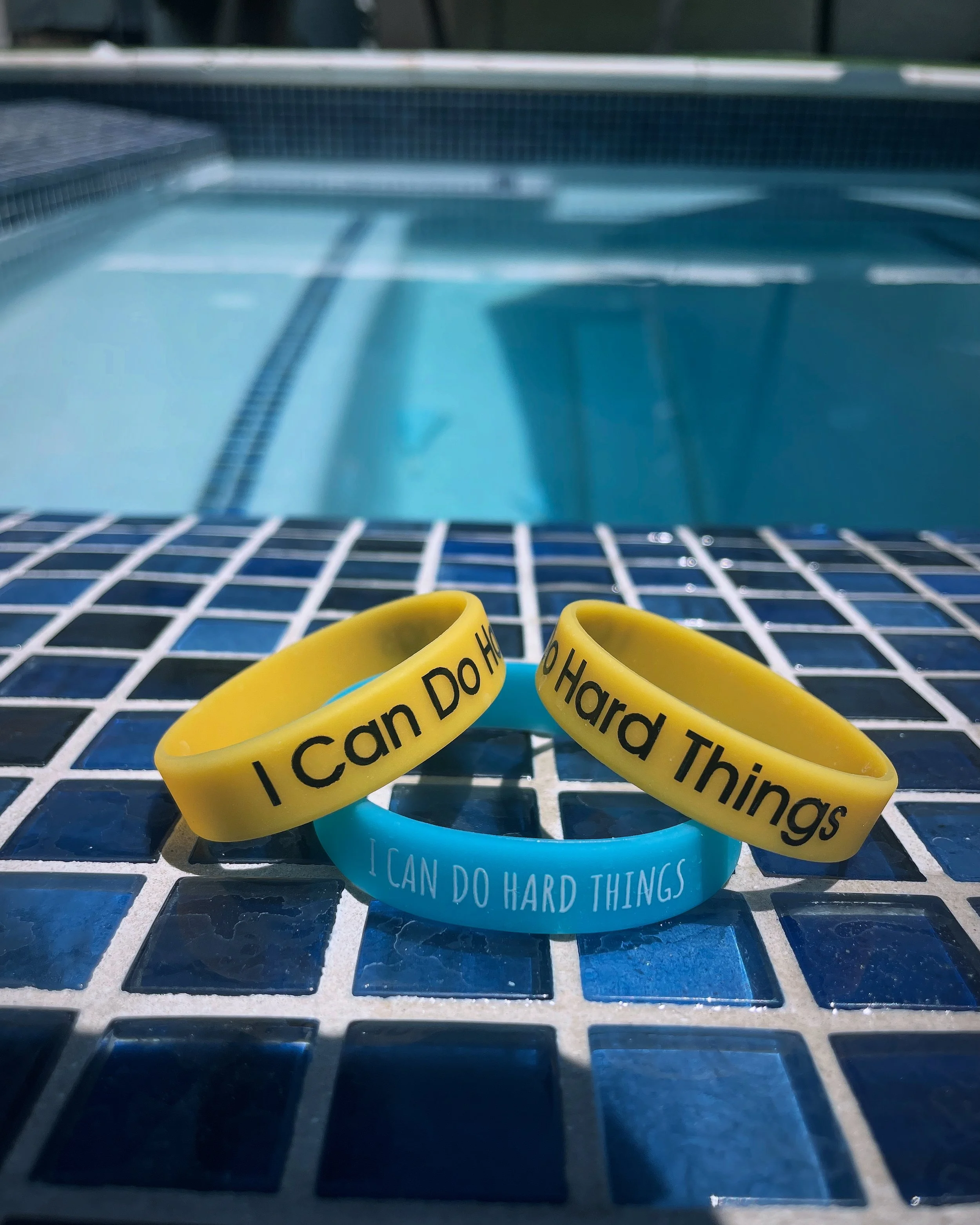 ALL students get a bracelet with our mantra "I Can Do Hard Things". This is part of their swimming lesson uniform. They should wear it for every class. It helps change their "I Can't Do It" negative thoughts into positive motivation thoughts. The pow