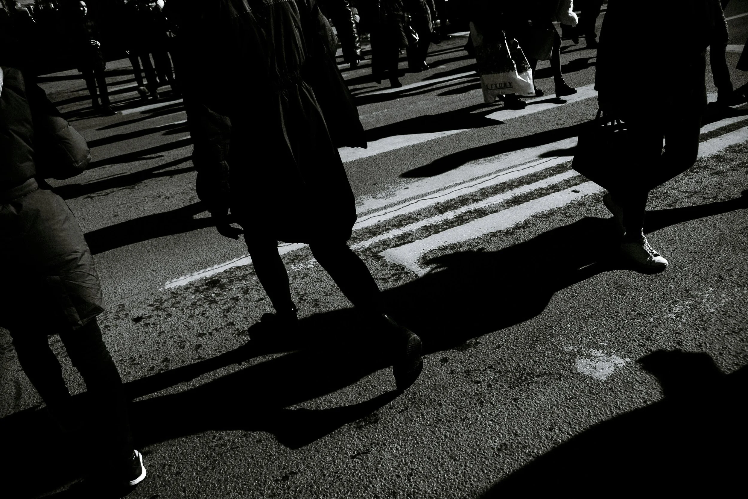 A vintage photograph of people walking on the street used as inspiration for the detached feel of Empire