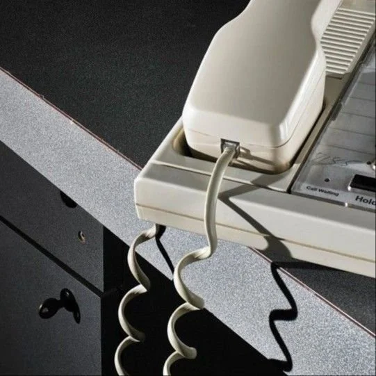 An 80s telephone, showing the ominous undertone of the album