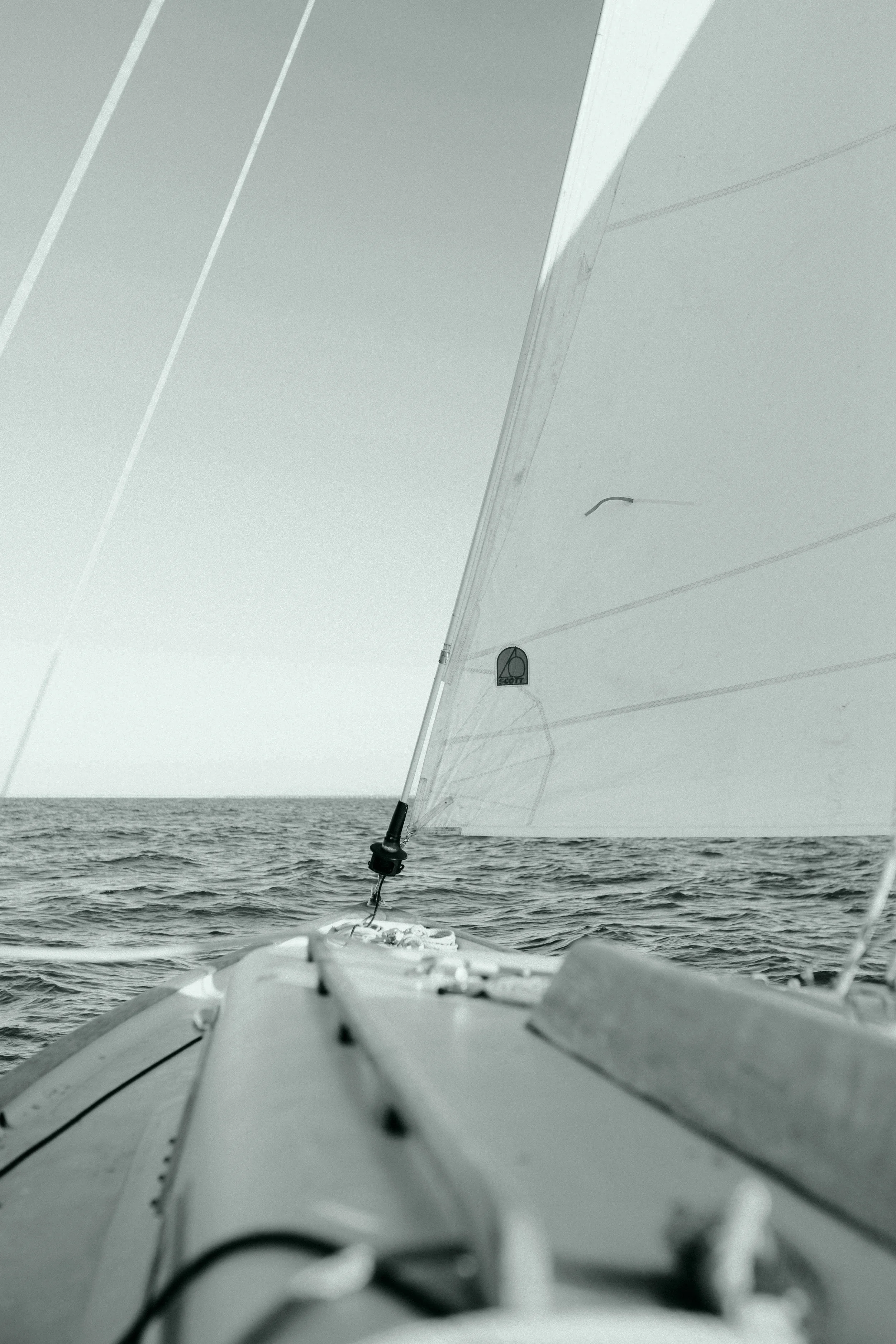 A detail shot of a sailboat at sea, meant to evoke the lonely feeling inspired by the song Anybody Listening?