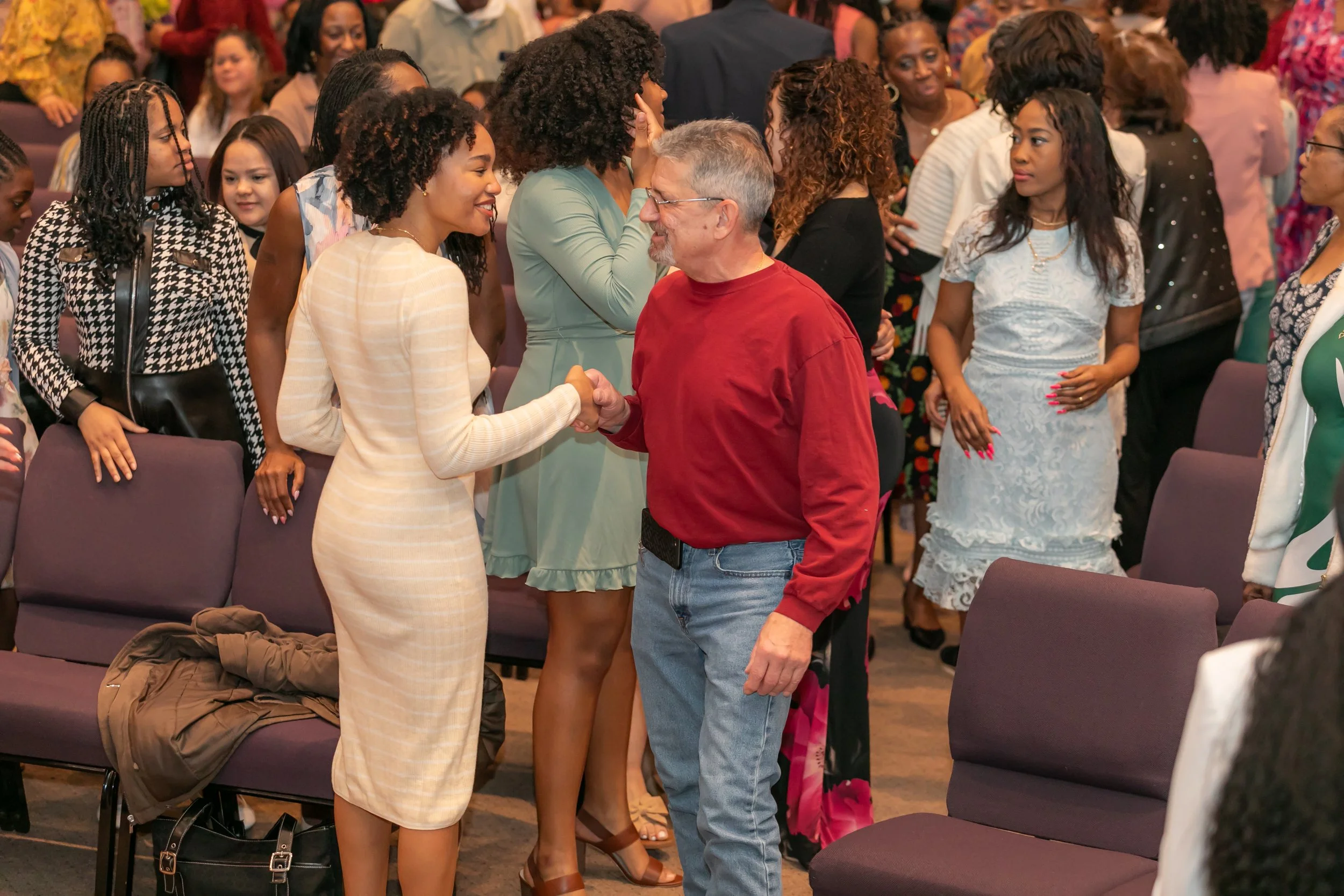 Guest being welcomed at Freedom Chapel in Amityville, NY before Sunday service.