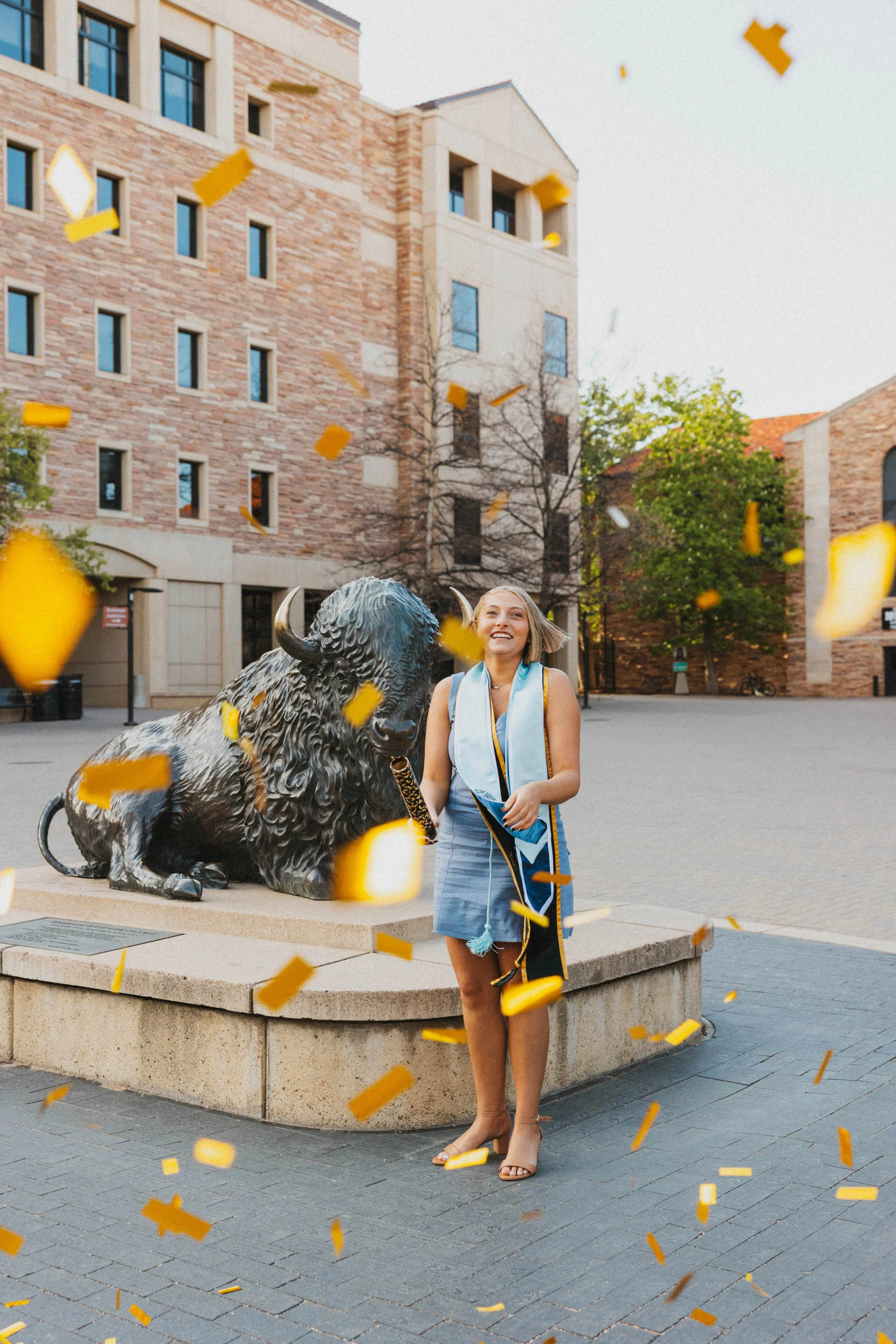 Student popping confetti at CU Boulder