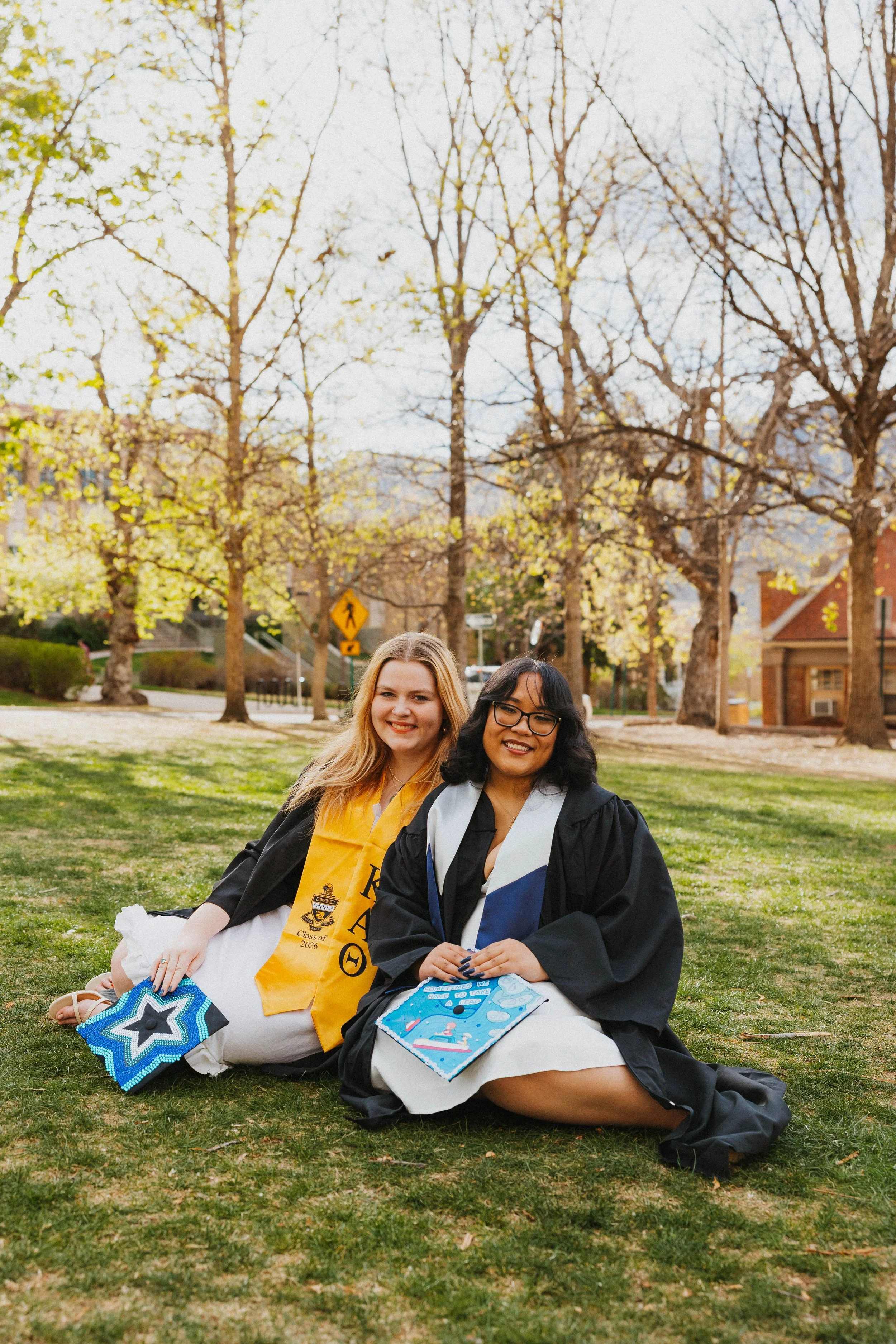 Two girls sitting on grass at School of Mines in Golden, Colorado
