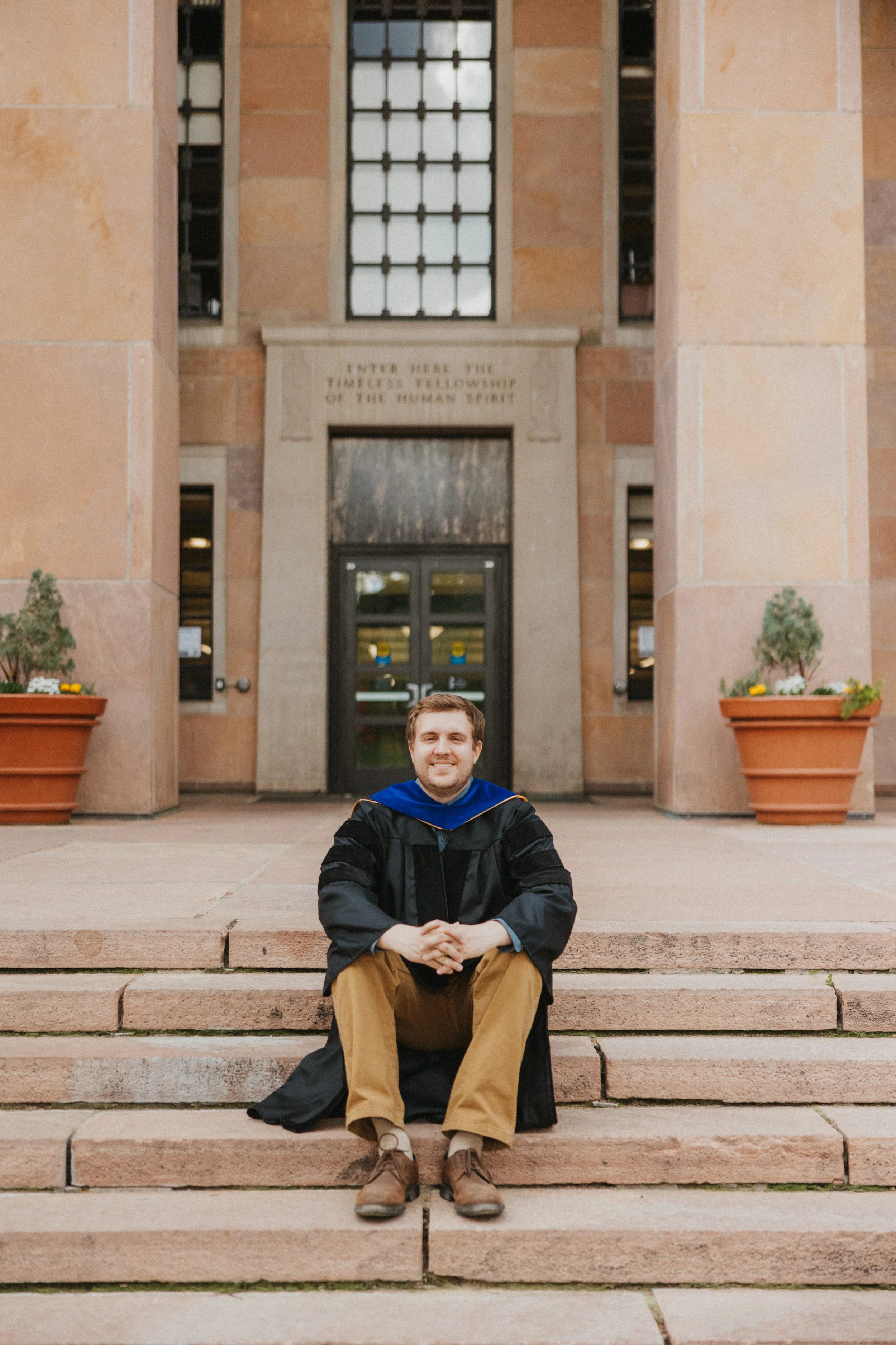 Graduate sitting at Norlin Library at CU Boulder
