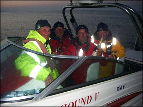 Round Britain and Ireland Record 2005. Finishing at last Bournmouth Pier, drinking Champagne and hot coffee supplied by time keeper Annie Beakhust. Gordon Compton, Chris Strickland, John Puddifoot, Jan Falkowski.