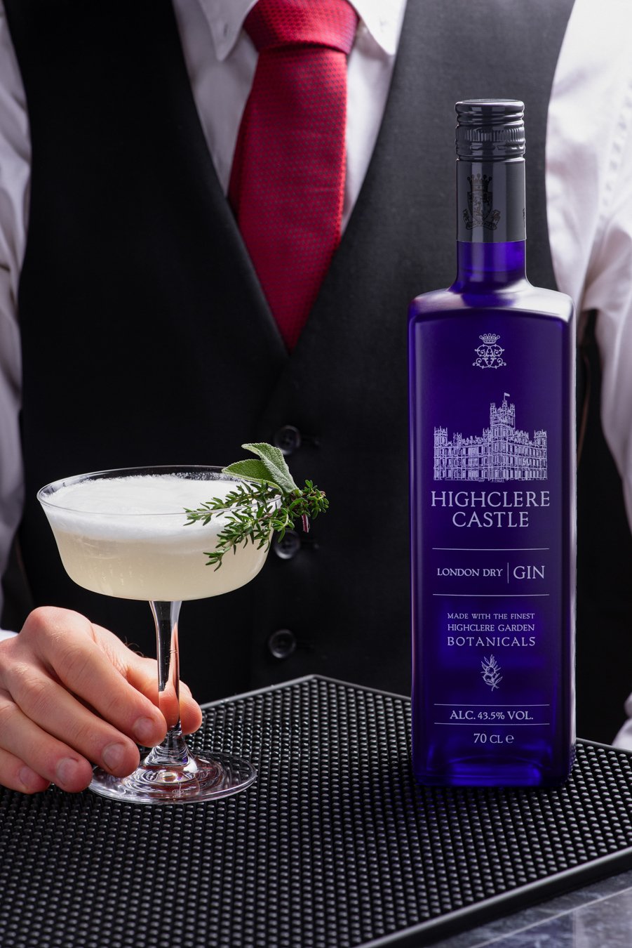 Butler serving a cocktail