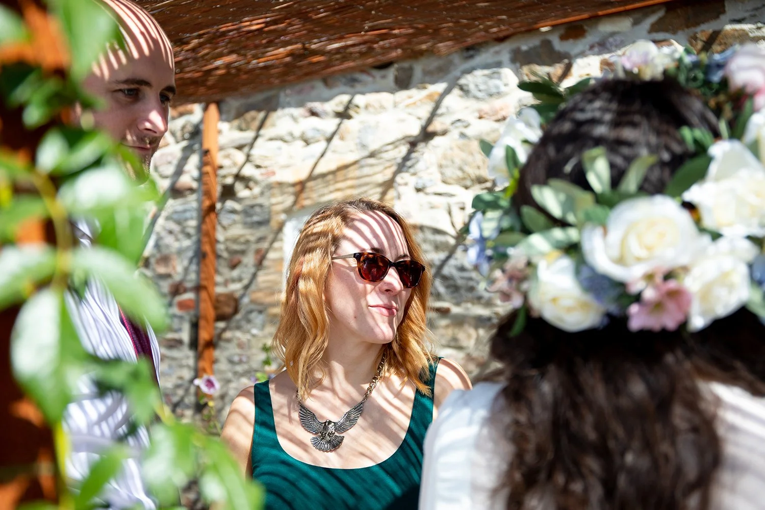 portrait of wedding guest listening to conversation