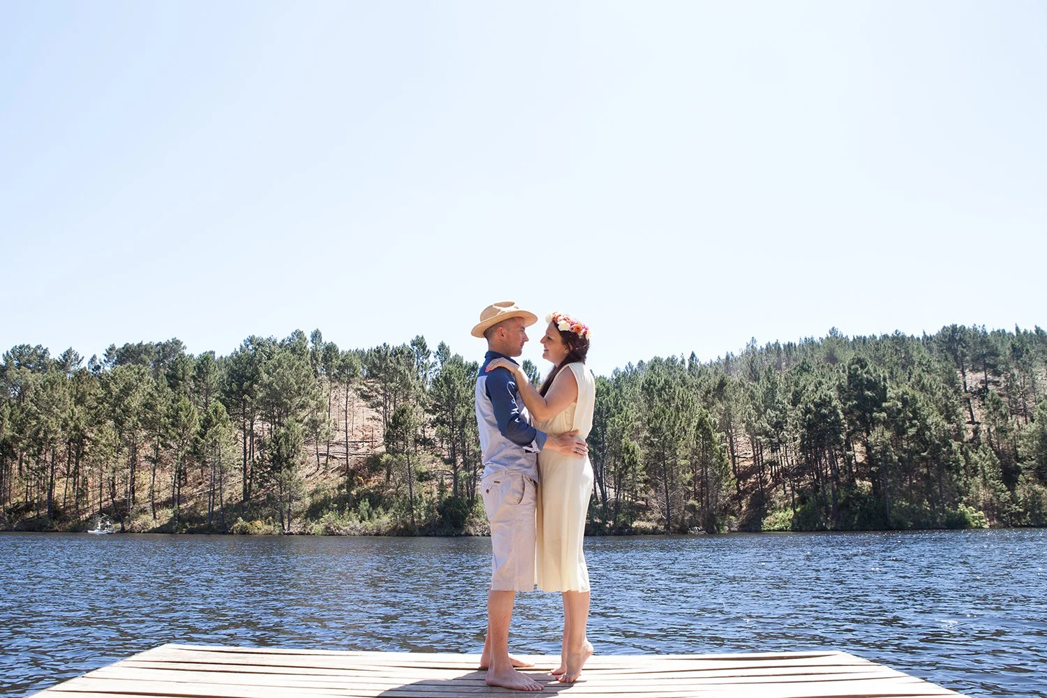 couple hugging by lake