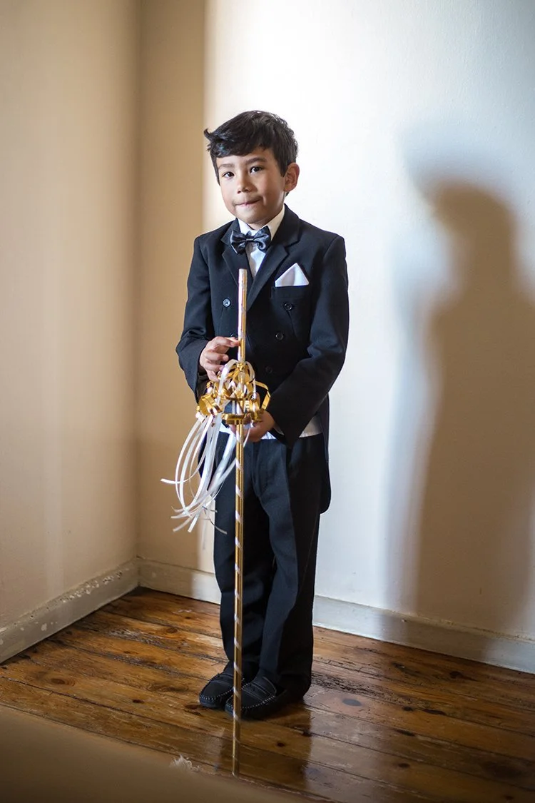 Hindu boy in suit with staff