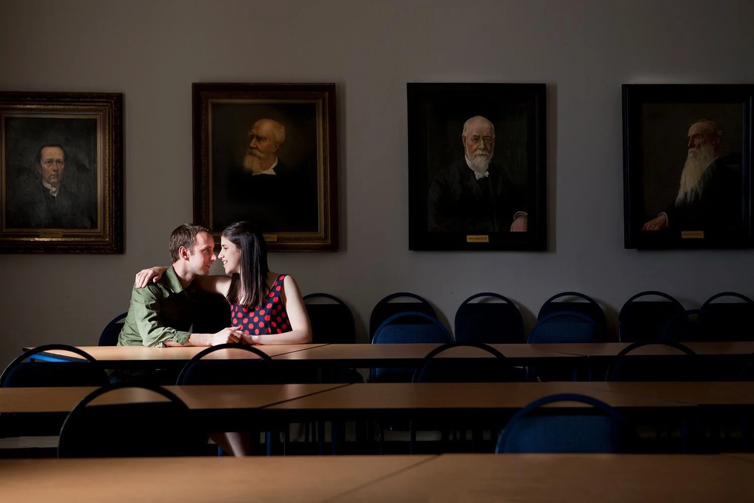 couple sitting in room loving each other during couple shoot