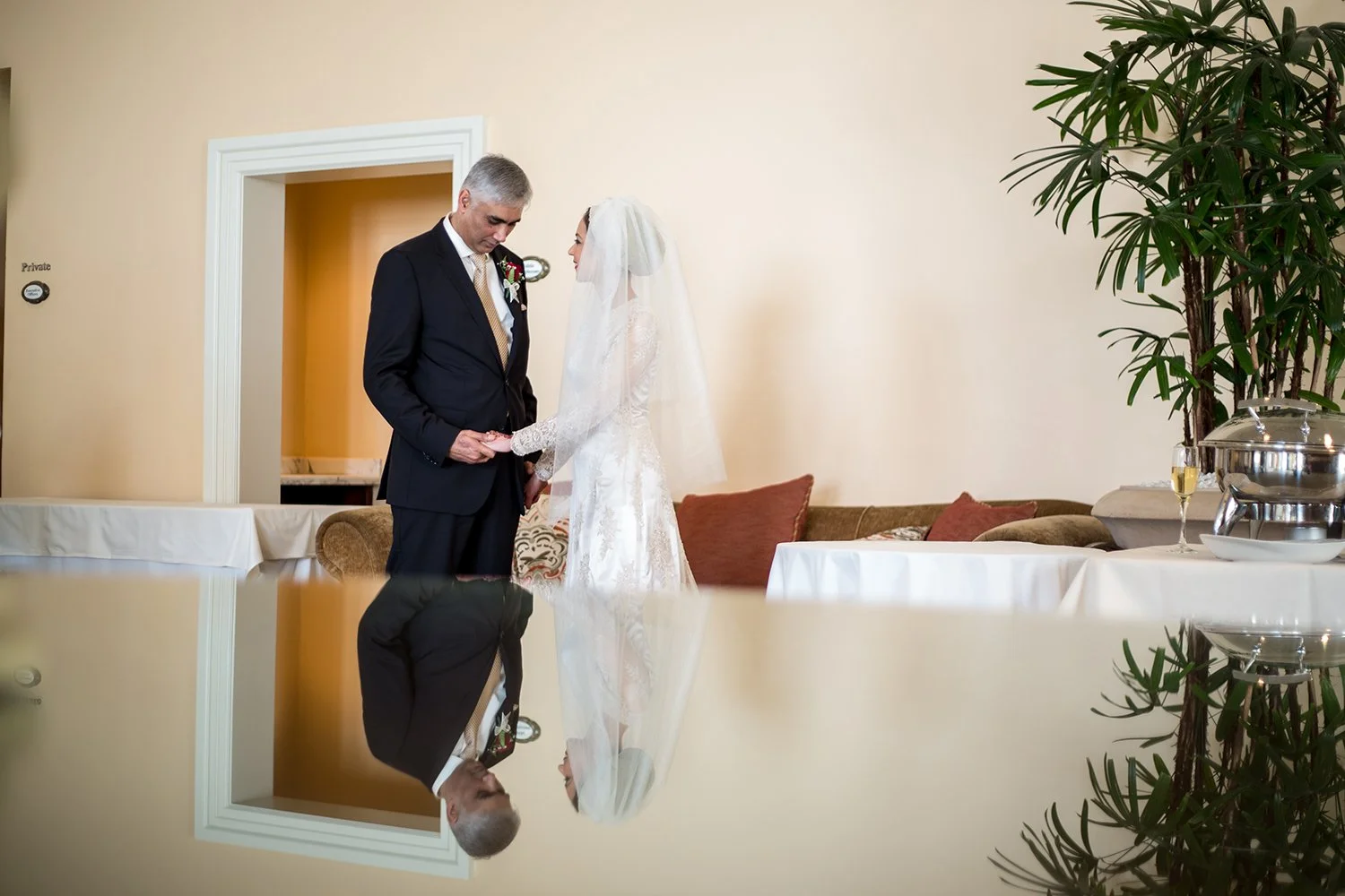 indian bride and groom holding hands before getting married