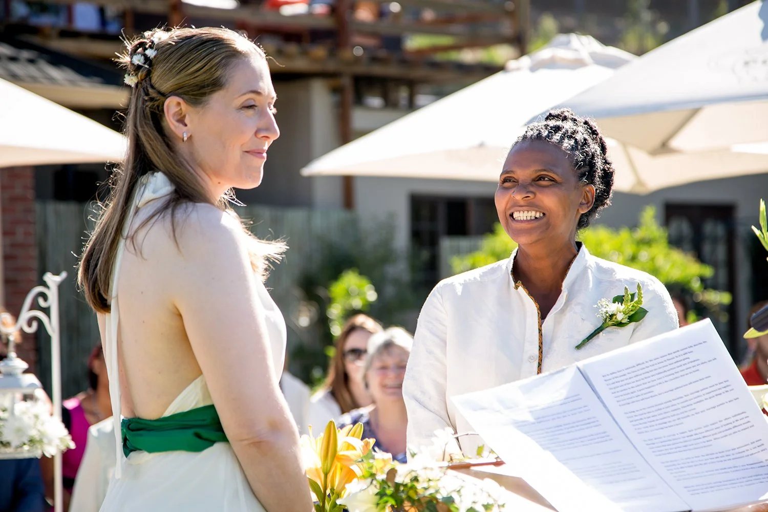 bride looking at bride during wedding ceremony