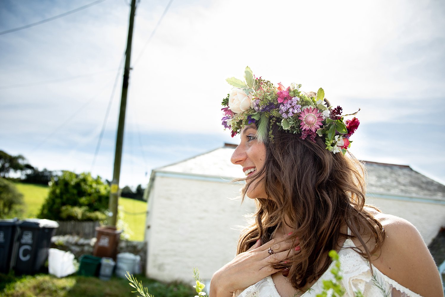 bride with flower crown laughing