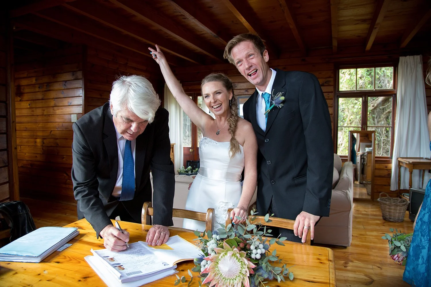 bride and groom signing register