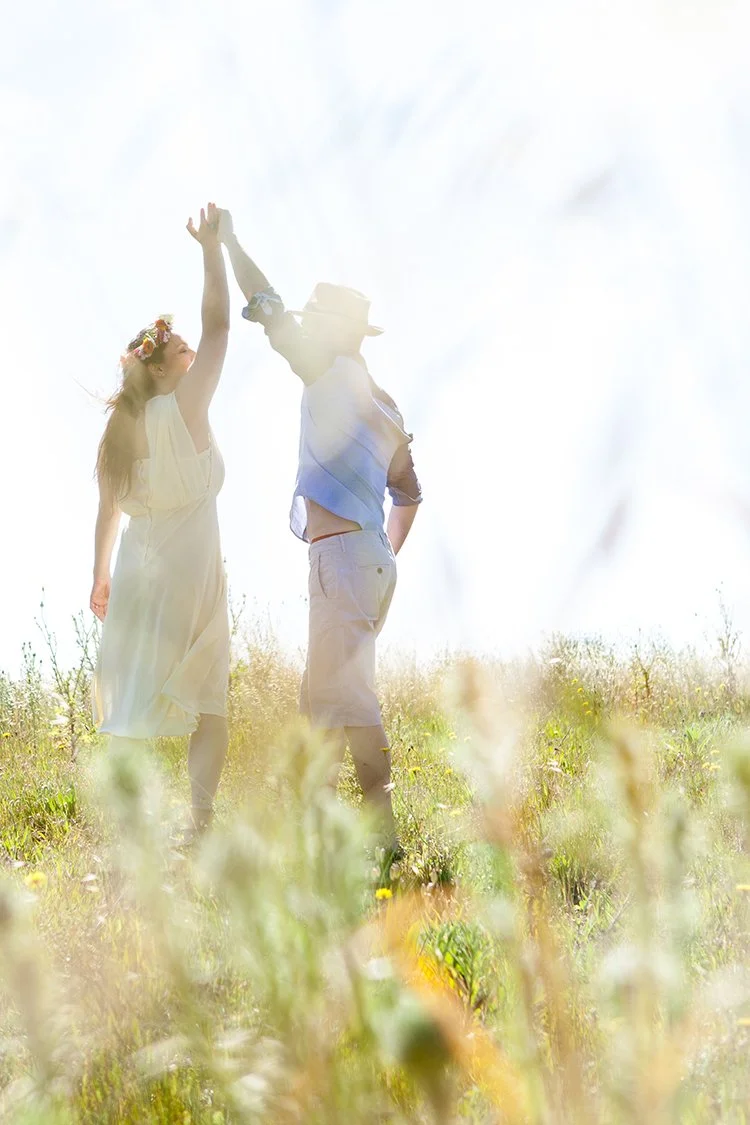 coiple dancing in field during couple shoot