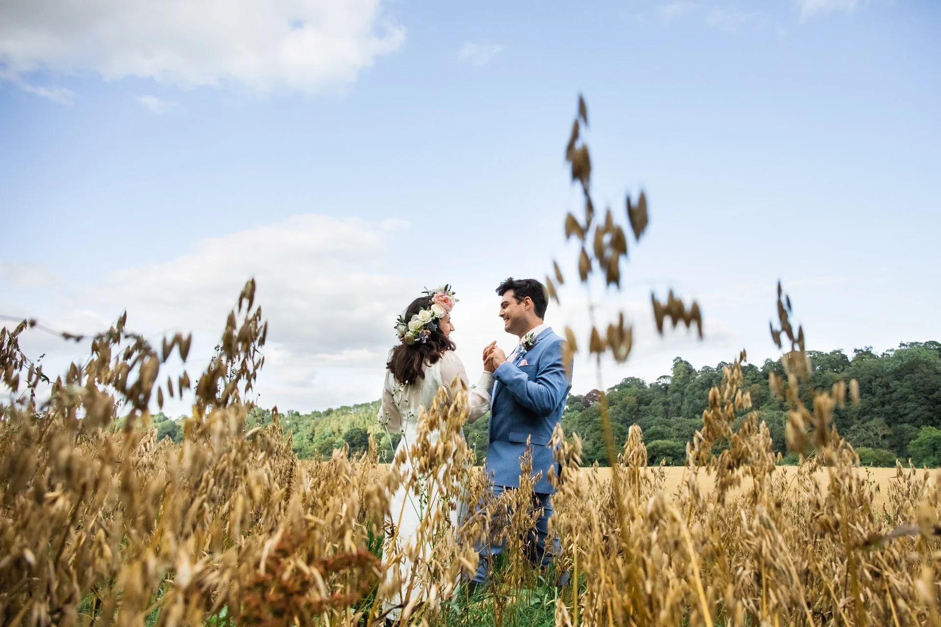 bride and groom in corn field