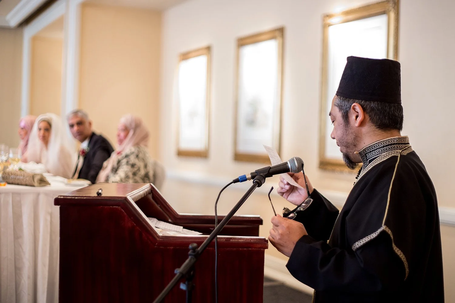 indian man speaking at Hindu wedding