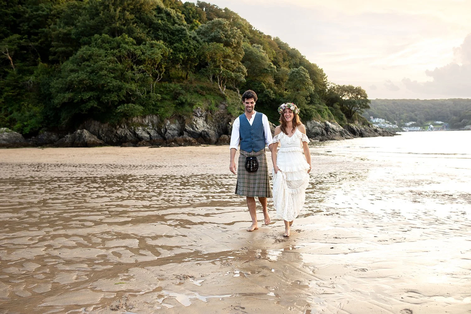 wedding photograph of bride and groom on devon beach