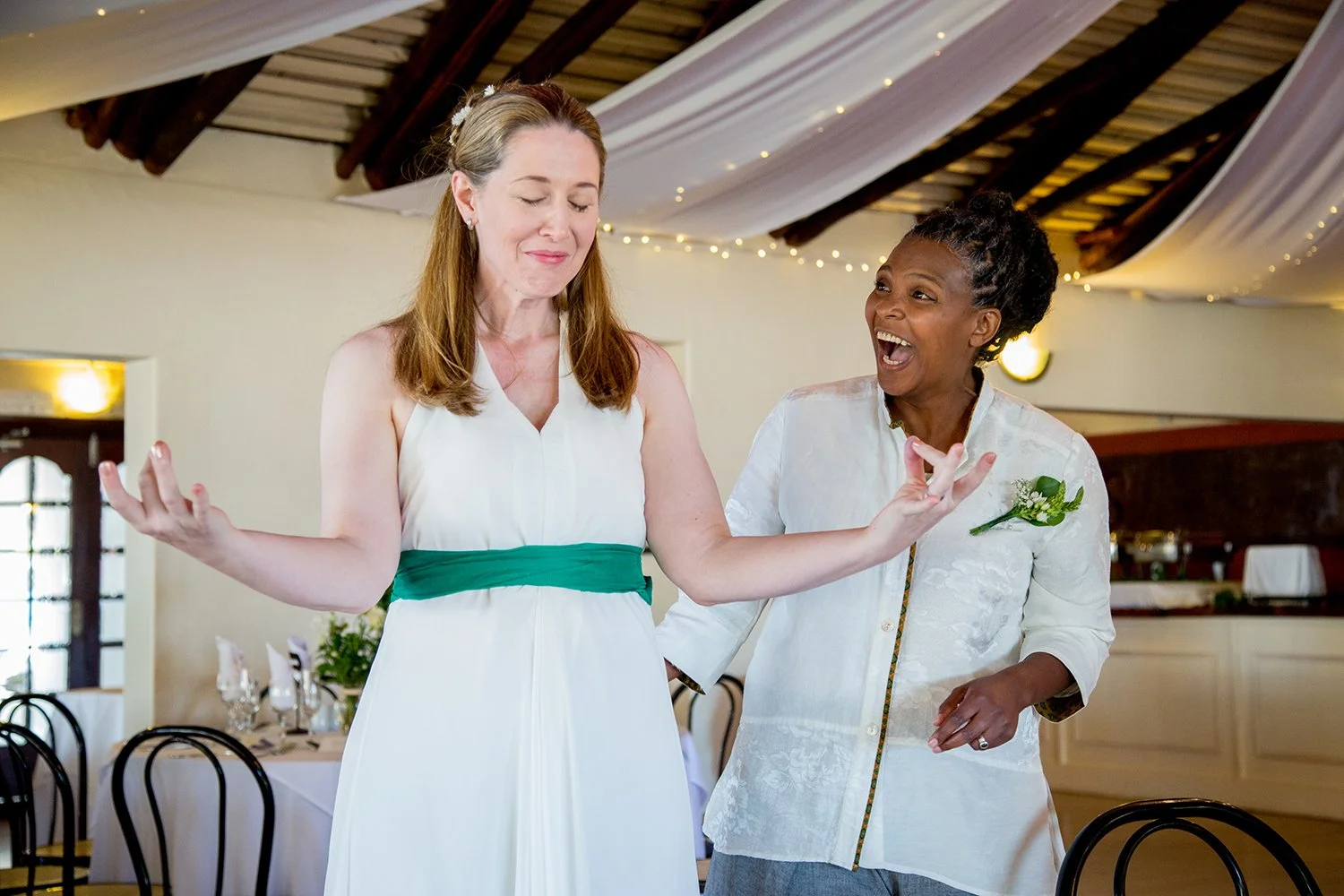 bride meditating whilst partner laughing