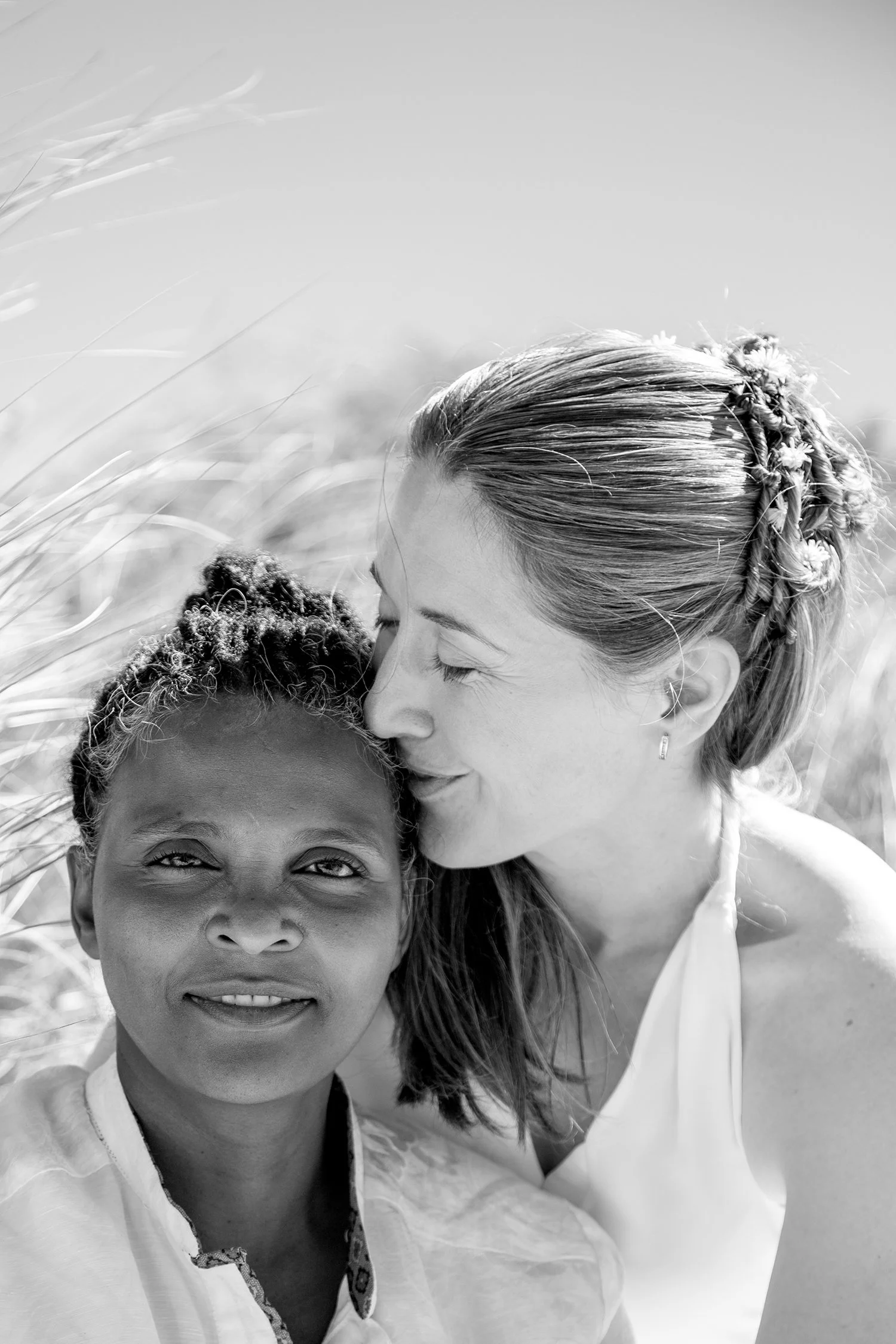 portrait of same sex couple in sand dunes