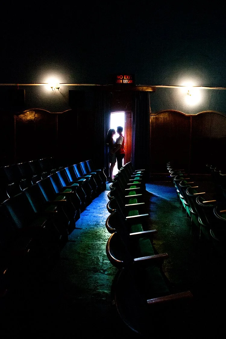 couple standing in door of cinema