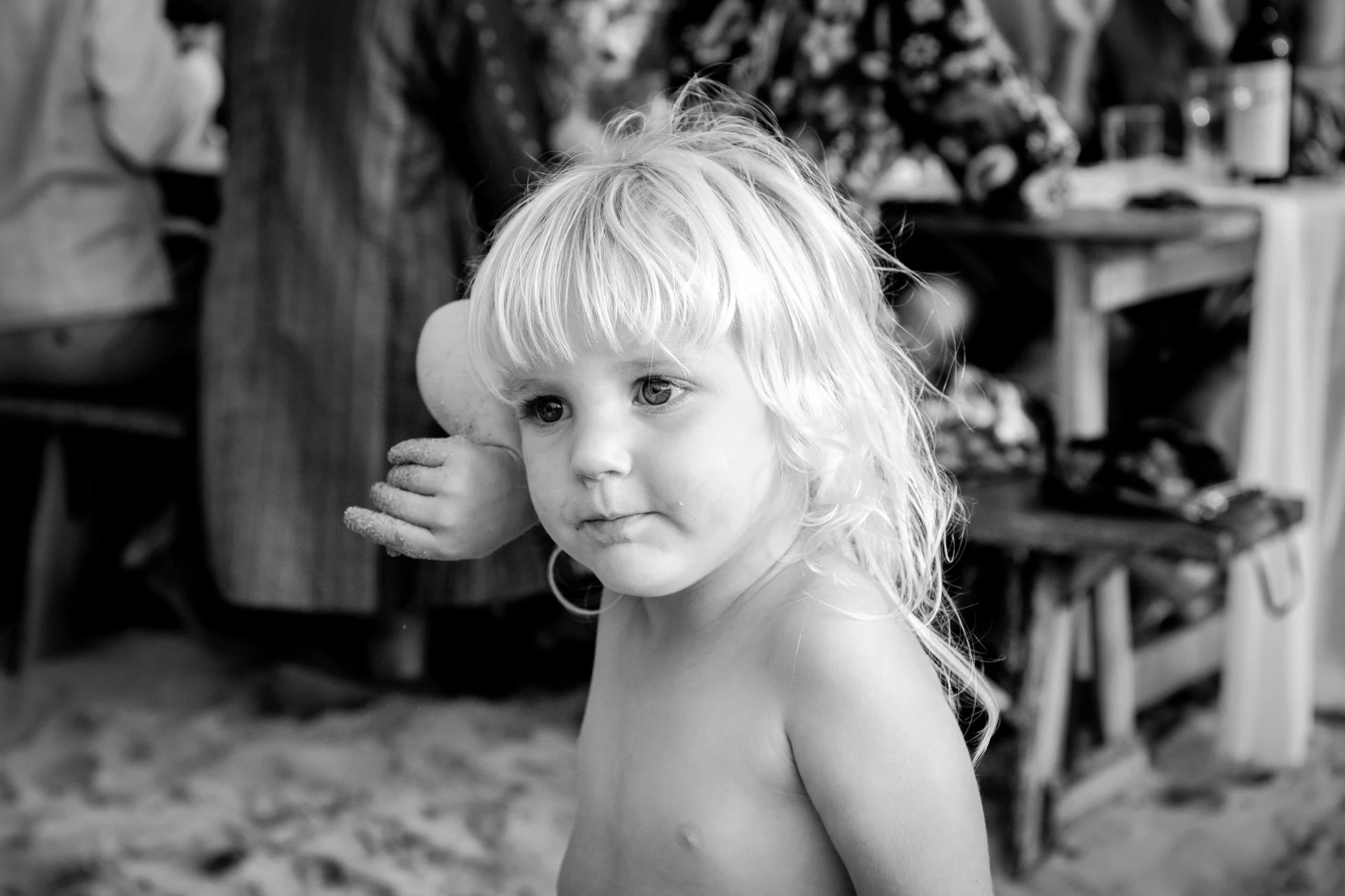 beautiful child playing at wedding on beach