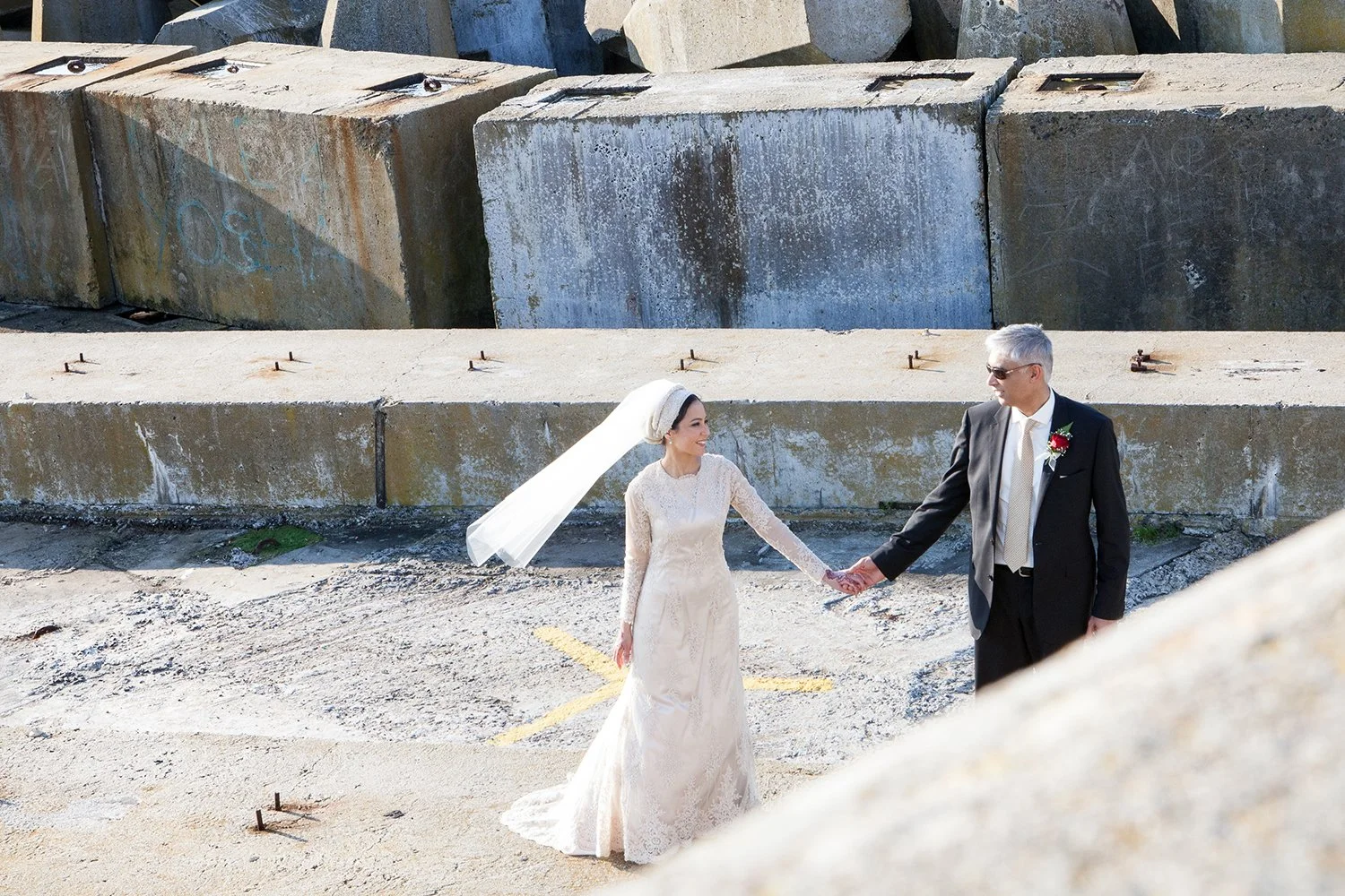 Hindu bride and groom holding hands