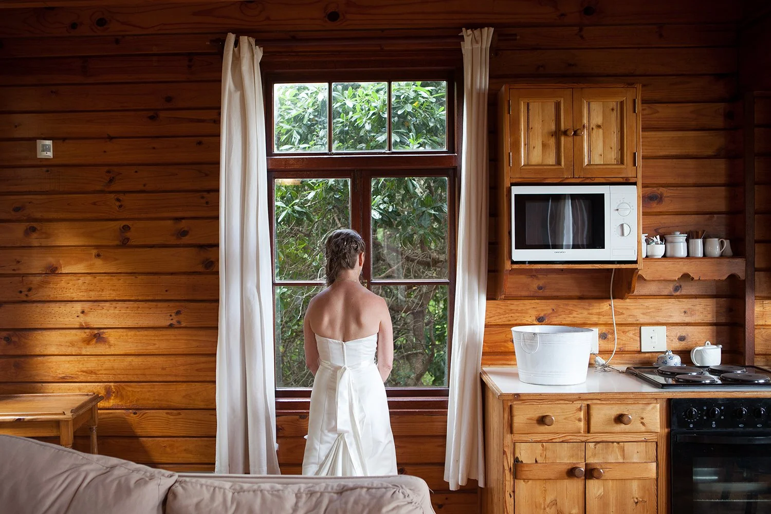 bride standing by window