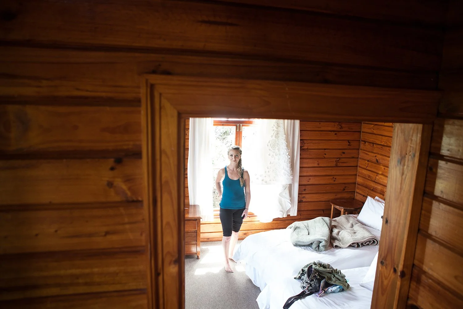bride standing in bedroom doorway