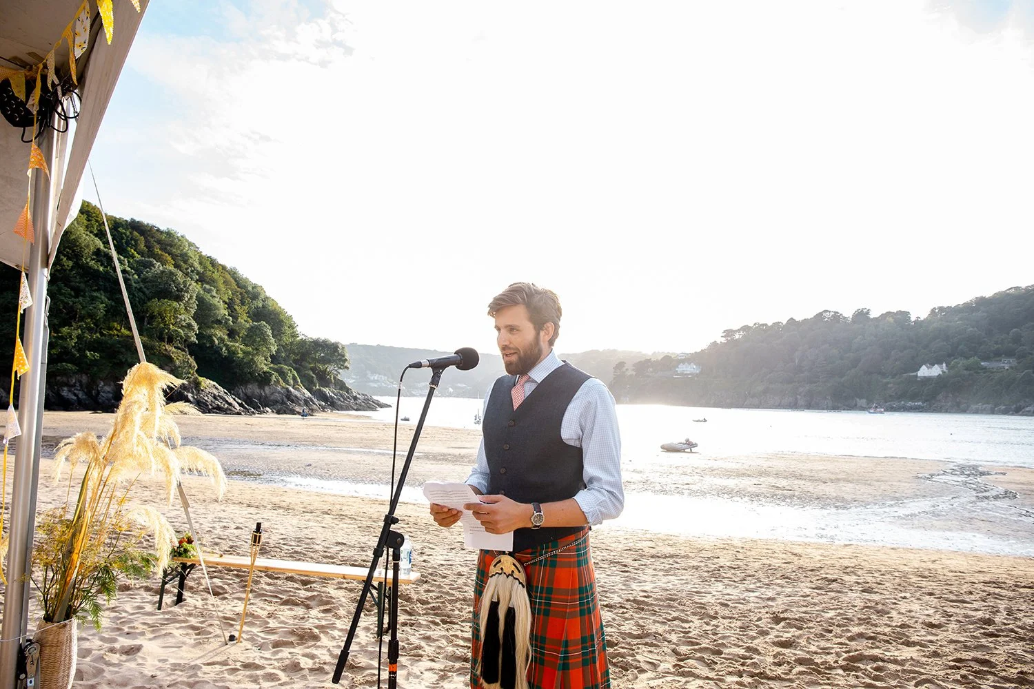 best man giving a speech at a beach wedding in  devon