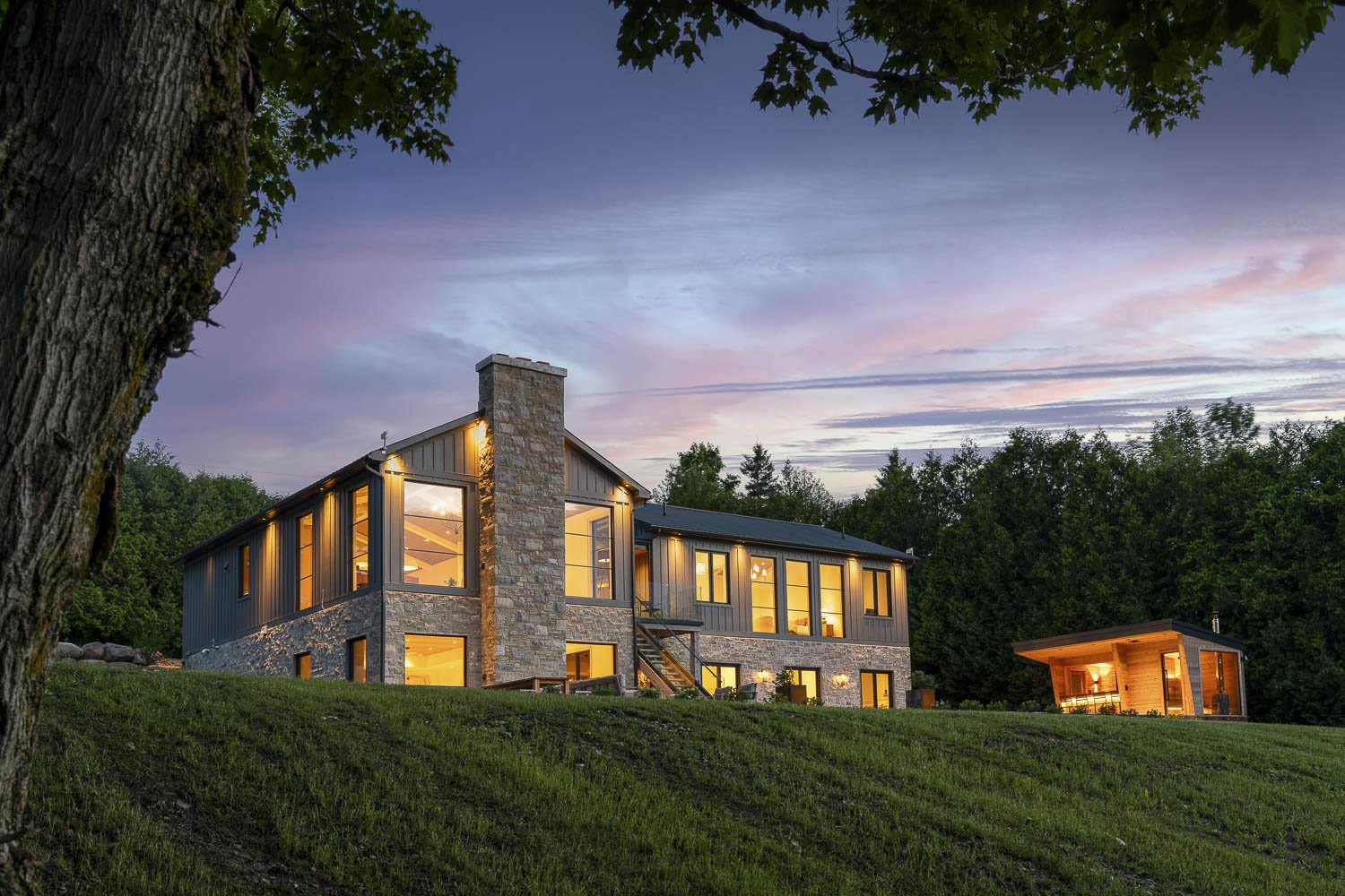 A twilight photo of a luxury home in Clearview, Ontario.