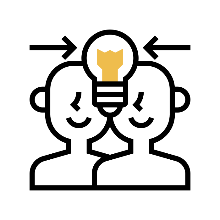 Two people with a shared lightbulb above their heads representing collaborative ideas.