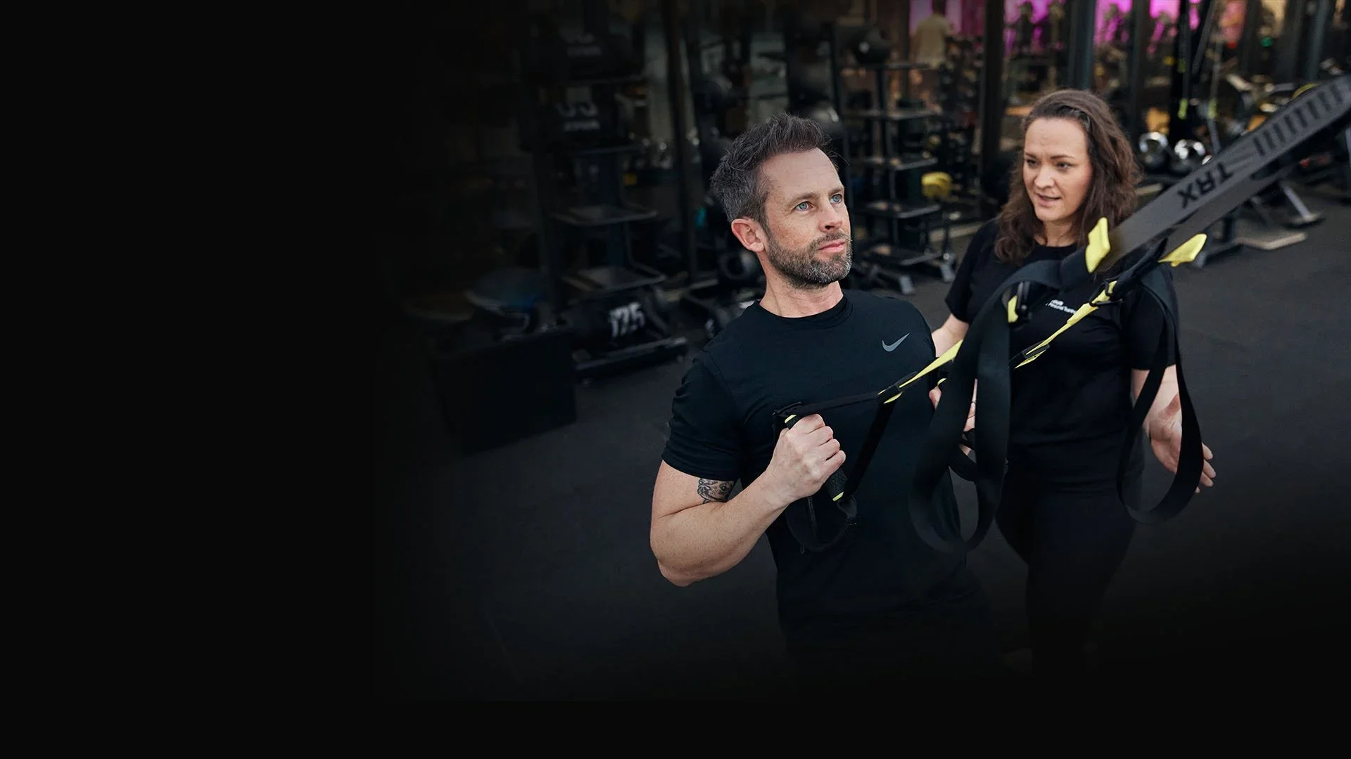 Learner practising suspension training with tutor guidance during the Level 3 CIMSPA-accredited Personal Trainer course.