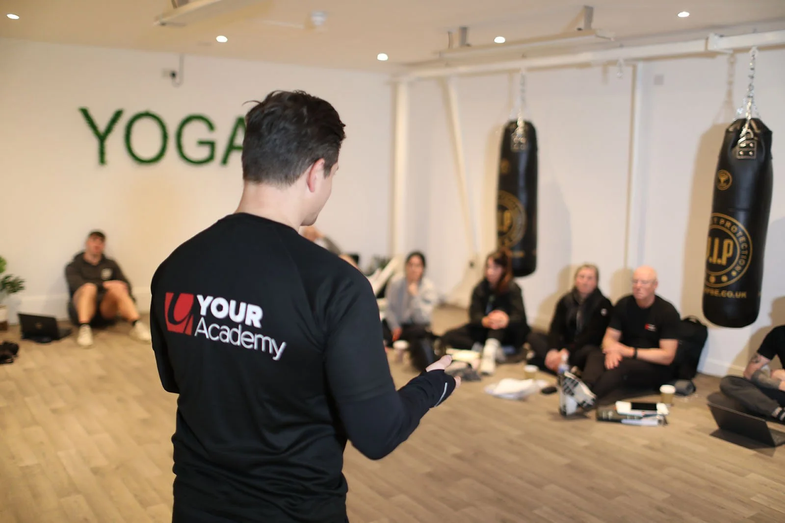 YOUR Academy gym instructor training workshop with students learning practical fitness instruction skills