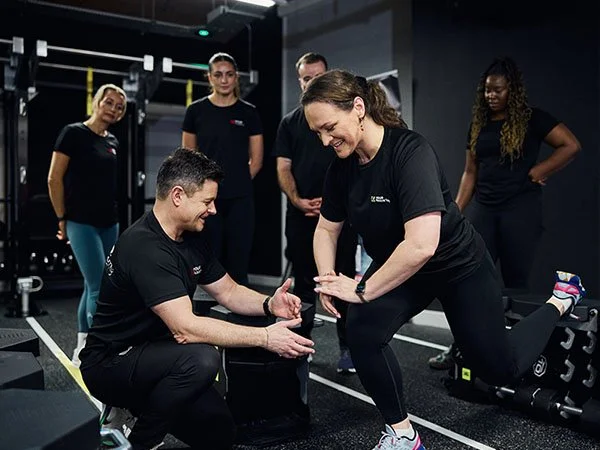 Group of trainee YOUR Academy personal trainers during hands-on gym session