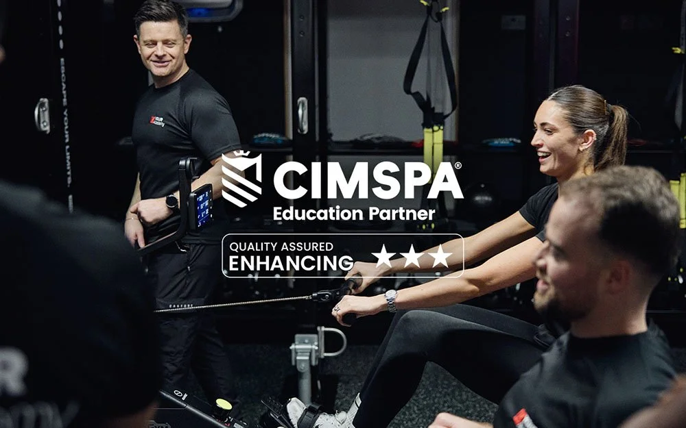 CIMSPA Education Partner and Quality Assured Enhancing badge over a YOUR Academy personal trainer coaching a gym workshop session