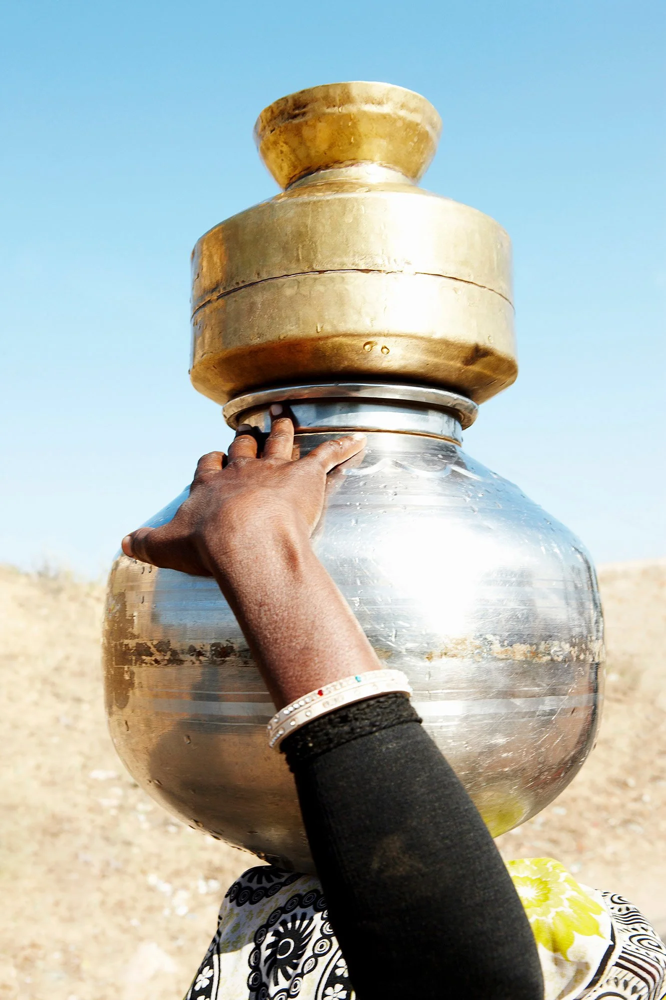 WOMAN CARRYING JUG Rajasthan, India 2010