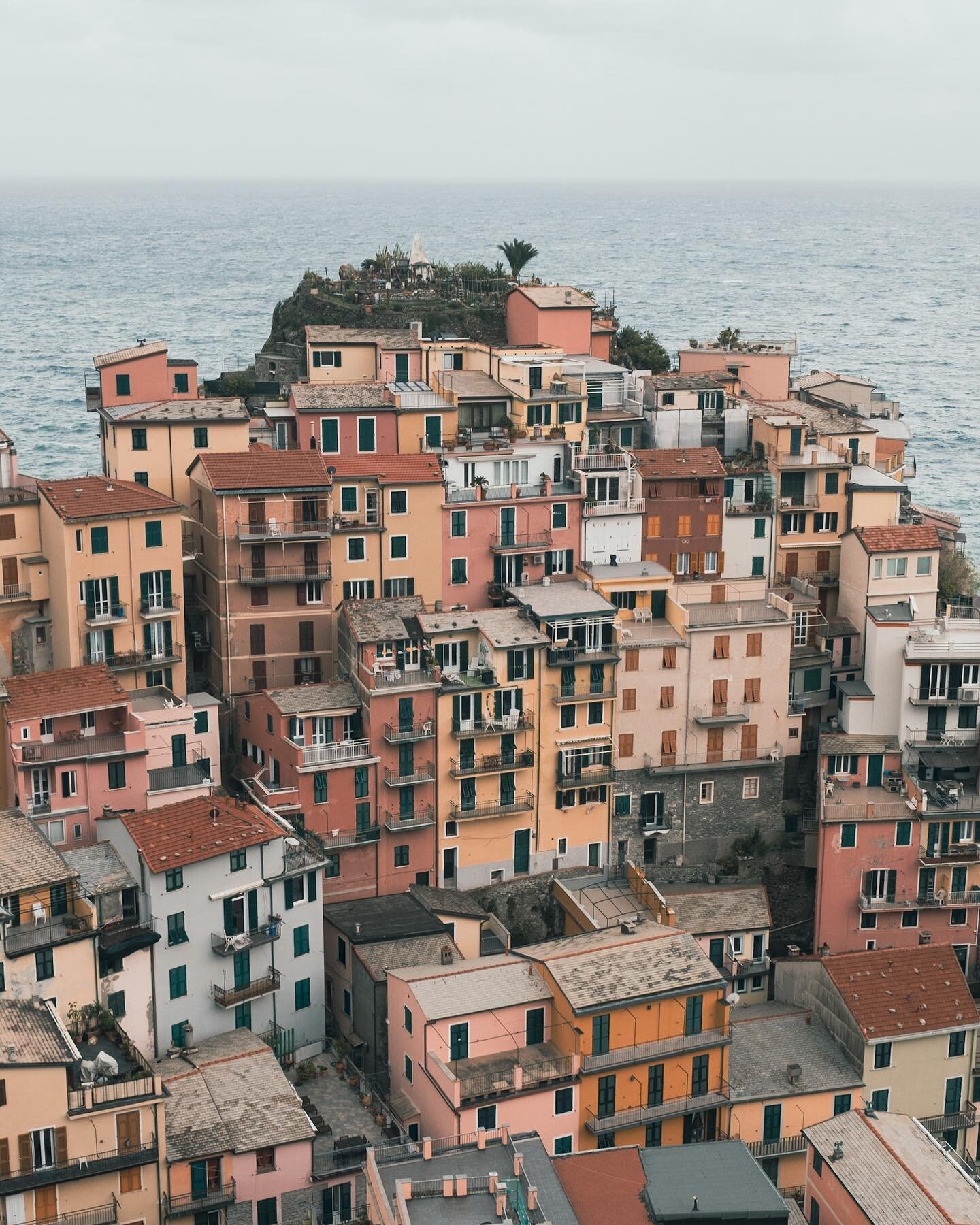 Tightly packed, Italian houses, look over stunning coast of the Chinqua terra. 

Many of these towns are overrun with photographers, particularly around, sunset. It&rsquo;s quite comical and slightly sad as all these people jostle for position to get