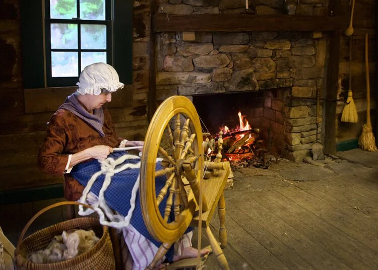 Debbie+spinning+FIBER FROLIC.jpg