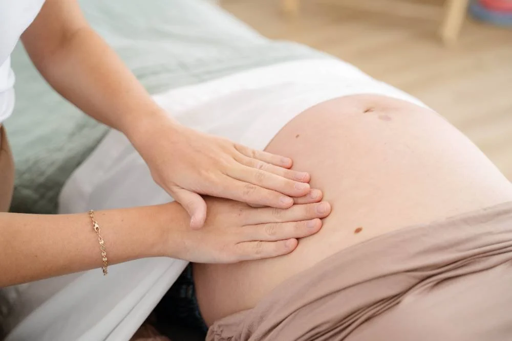 Prenatal massage therapy session at The Wellness Hub in Stoney Creek clinic