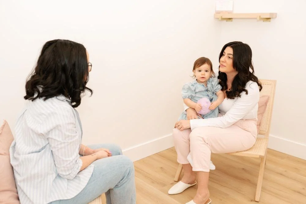 julia holding baby during psychotherapy session