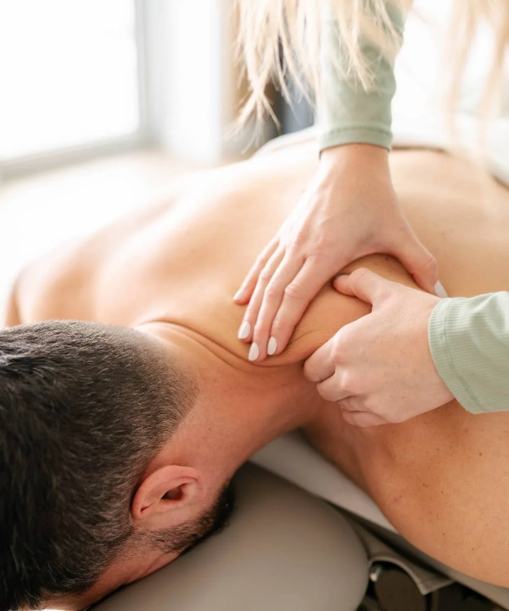 Professional massage therapy session at Stoney Creek wellness clinic treatment room